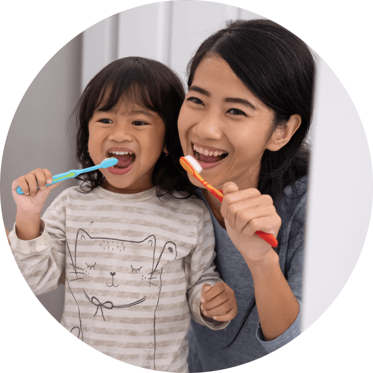 mother and daughter brushing teeth Pittsfield, MA