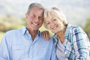 Dental Patient Couple Smiling After A Father's Day Dental Implant Procedure