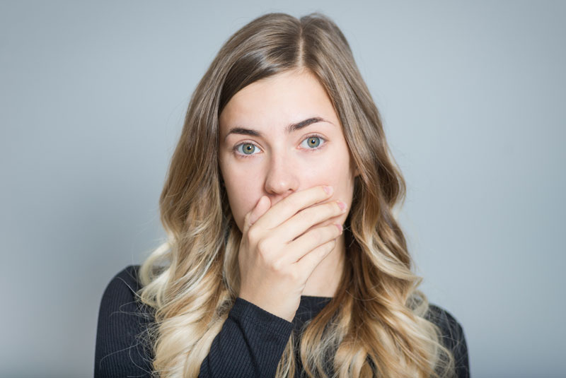 Dental Patient Hiding Her Missing Tooth