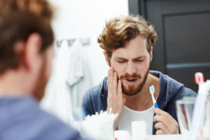 Dental Patient Suffering From Gum Disease And Is In Pain