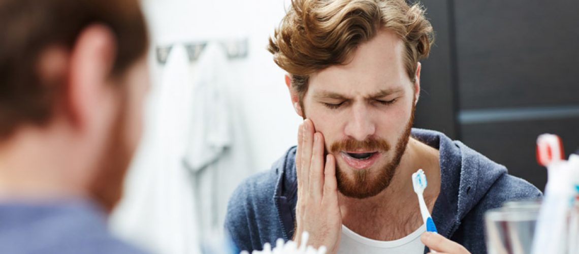 Dental Patient Suffering From Gum Disease And Is In Pain