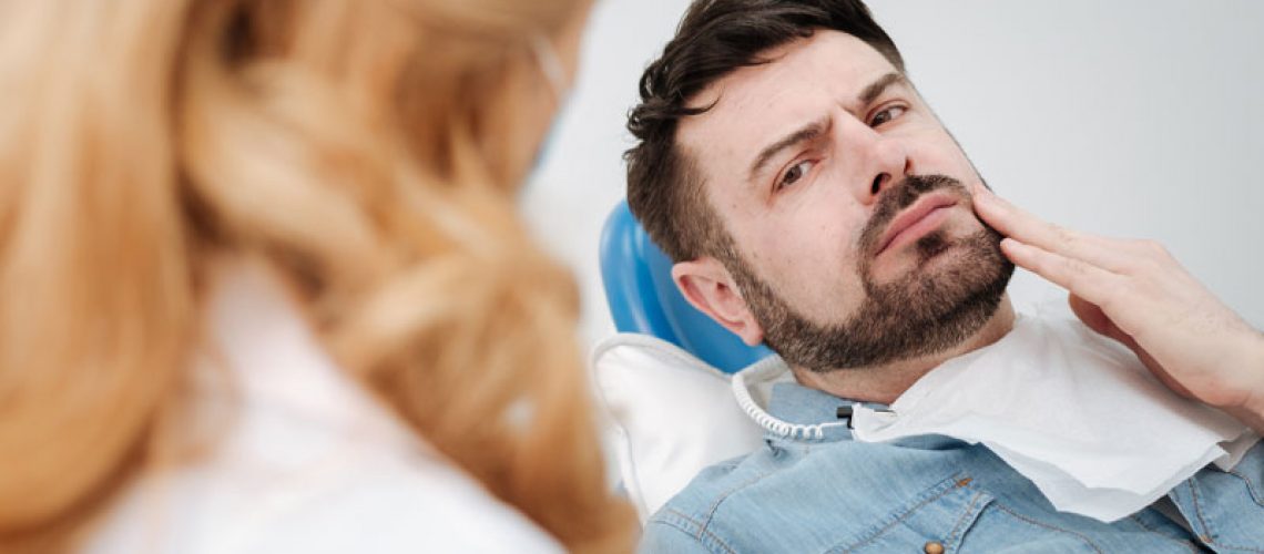 Dental Patient Suffering From Failing Dental Implant
